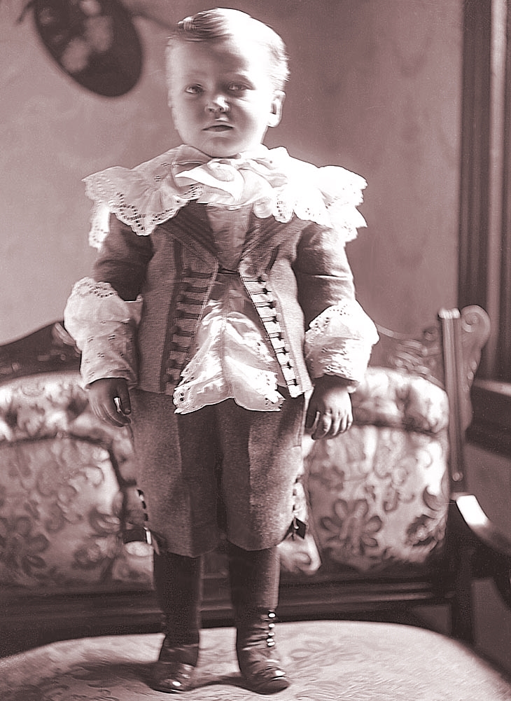 James Lee Fisher in a Dress standing on a chair, ca. 1897