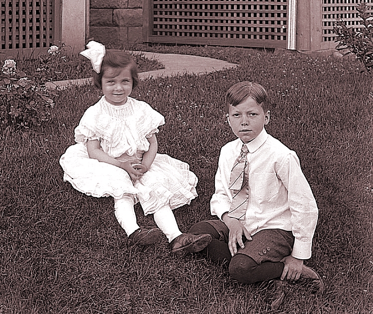 James Lee Fisher and his cousin Evelyn Zentmyer Goff, and a cage full of bunnies, Freeport, ca. 1904